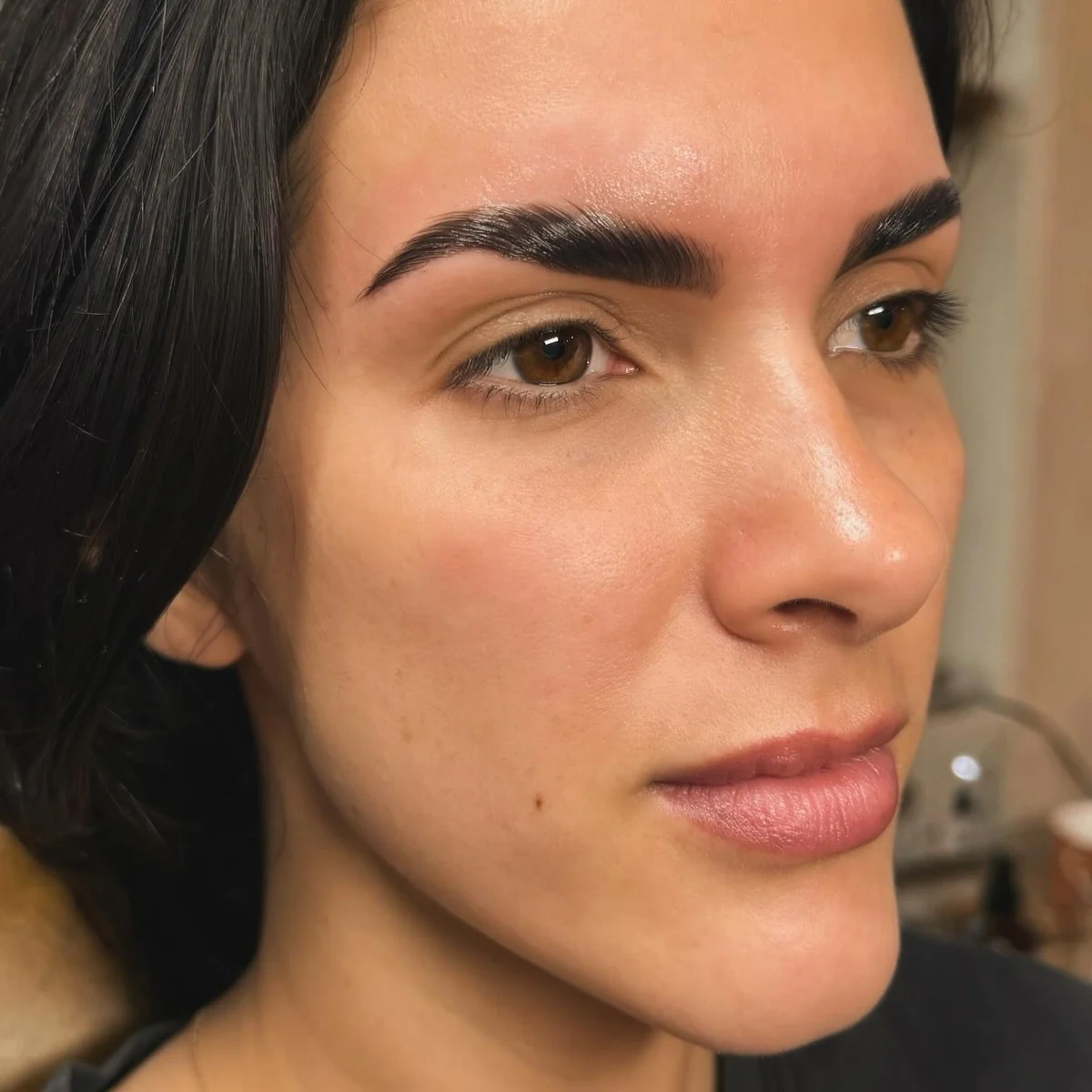 Client profile showing dark, sculpted brows